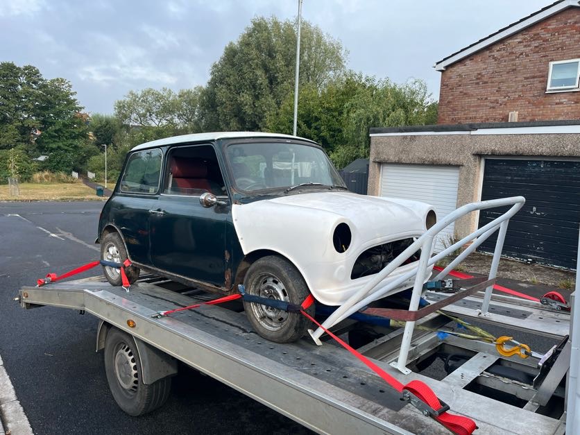 Black classic Volkswagen Beetle convertible on the AL Services car transporter