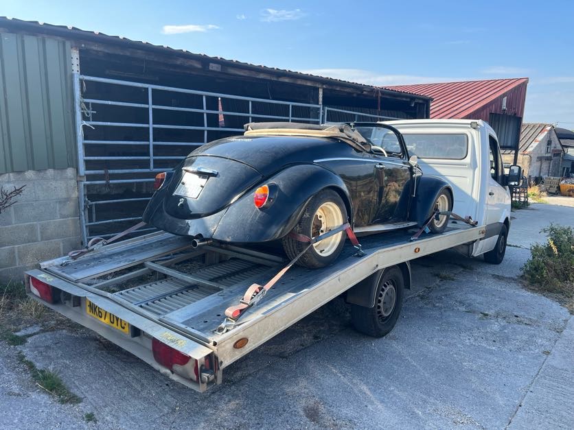 White SUV being delivered on the AL Services car transporter